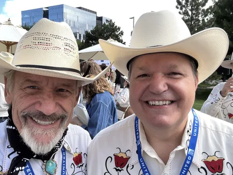 Doug Tisdale with community supporters at an outdoor event