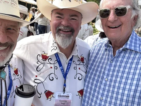 Doug Tisdale with community supporters at an outdoor event
