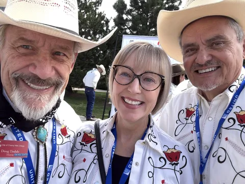 Doug Tisdale with community supporters at an outdoor event